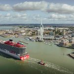 Virgin Voyages Resilient Lady sails into Portsmouth harbour with the backdrop of the Spinnaker Tower