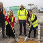 Sea Change partners, all wearing high-vis, mark the start of civils works by planting two shovels in the ground